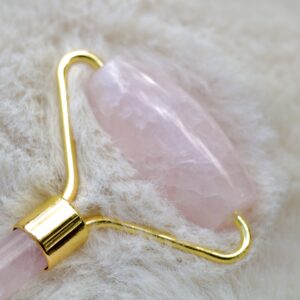 rose quartz crystal face roller for face care and wellbeing